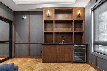 A kitchen with a wooden counter and shelves.